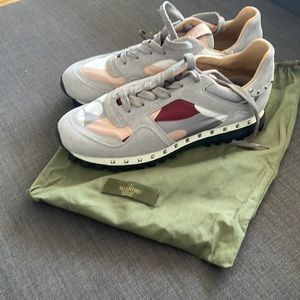 Valentino pink camouflage sneakers.